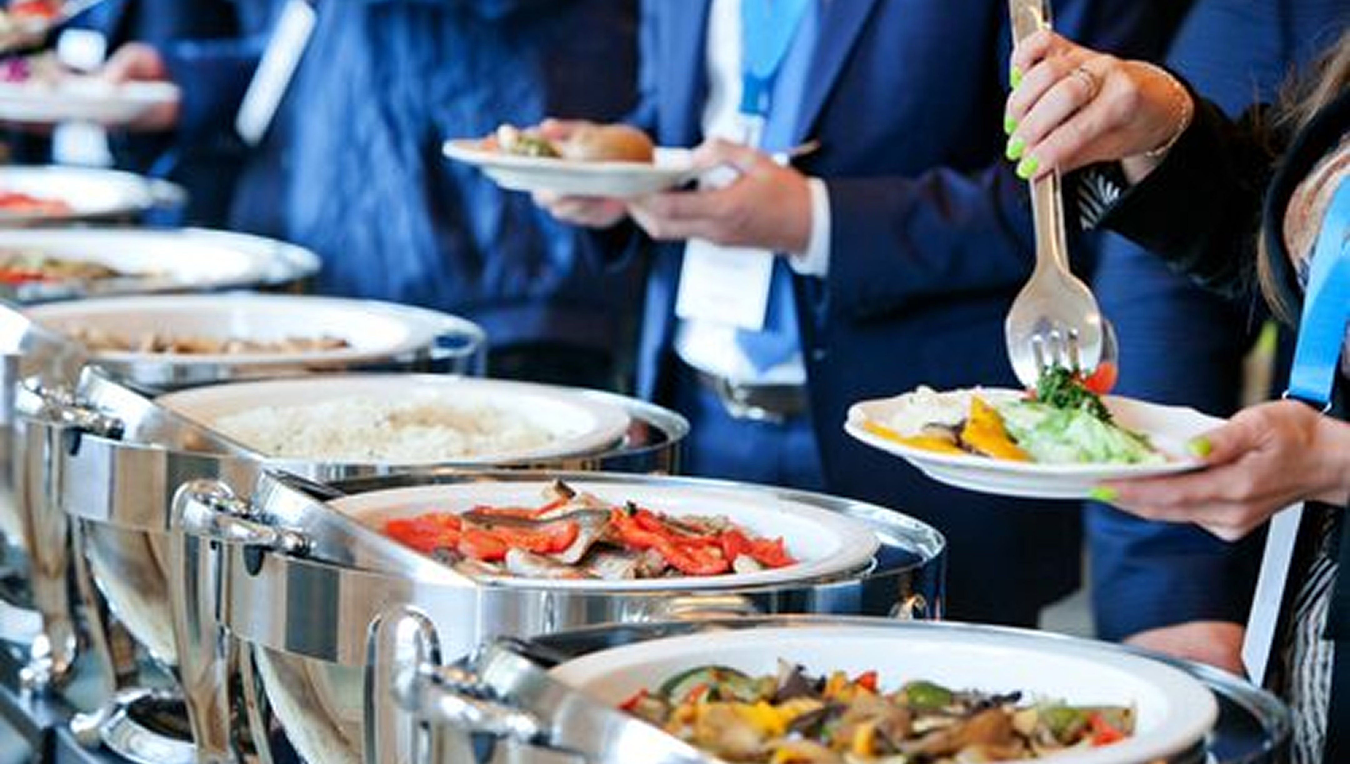 Corporate catering event with people serving food