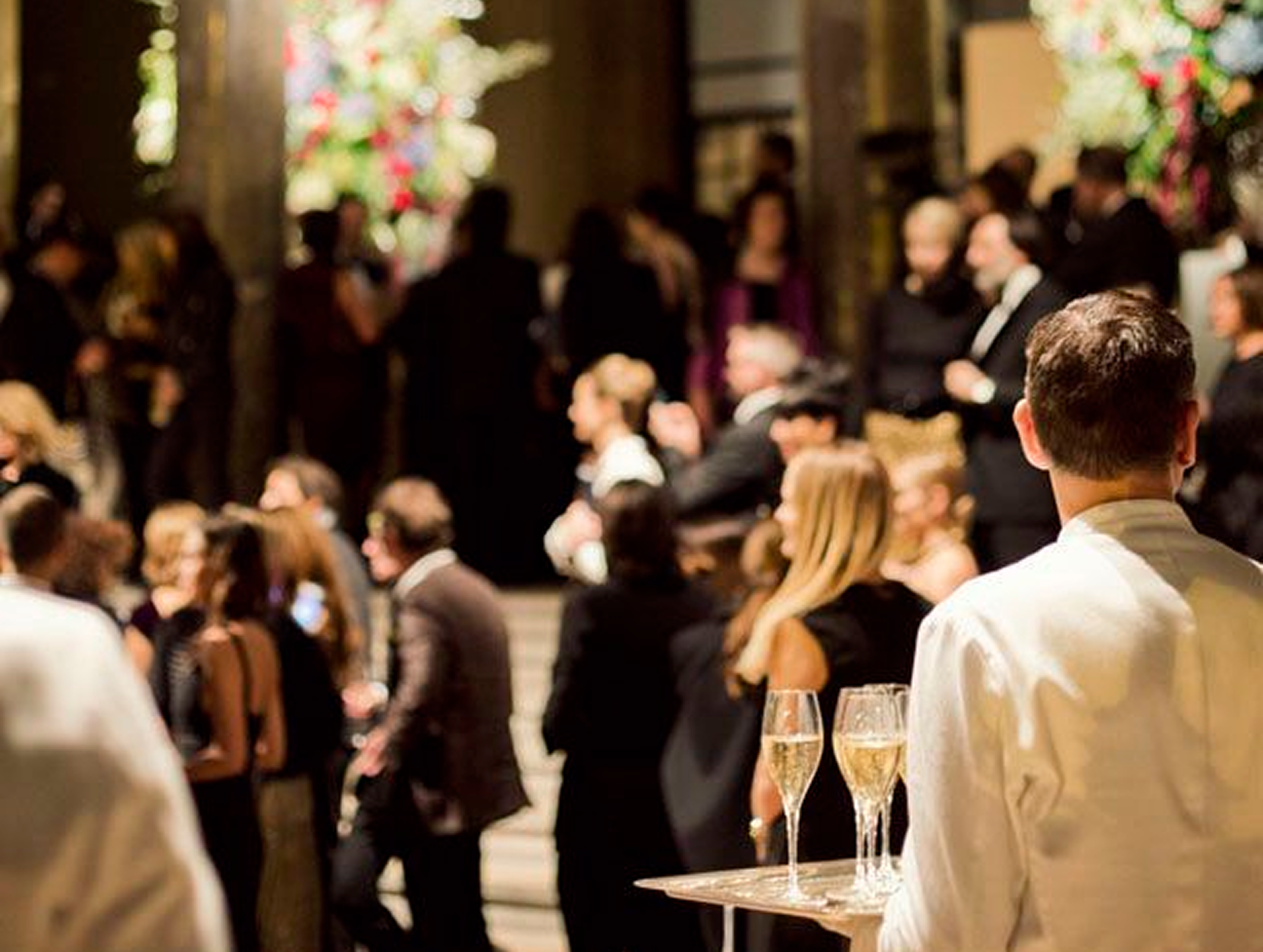 Corporate event with waiters serving