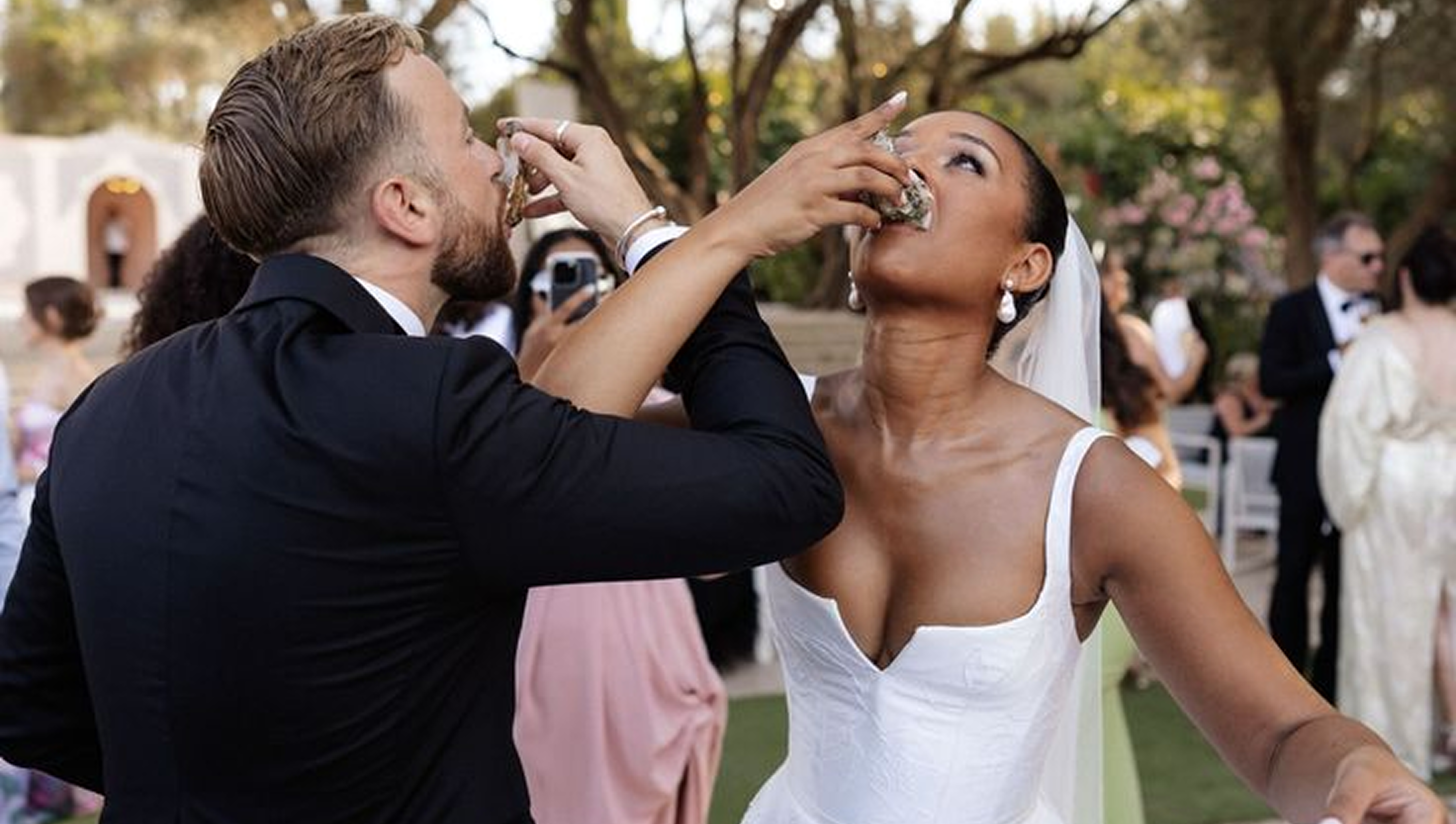 Wedding couple feeding each other cake